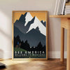 Vintage travel poster depicting Montana's green valleys under an orange sky - beside a round wooden side table with books