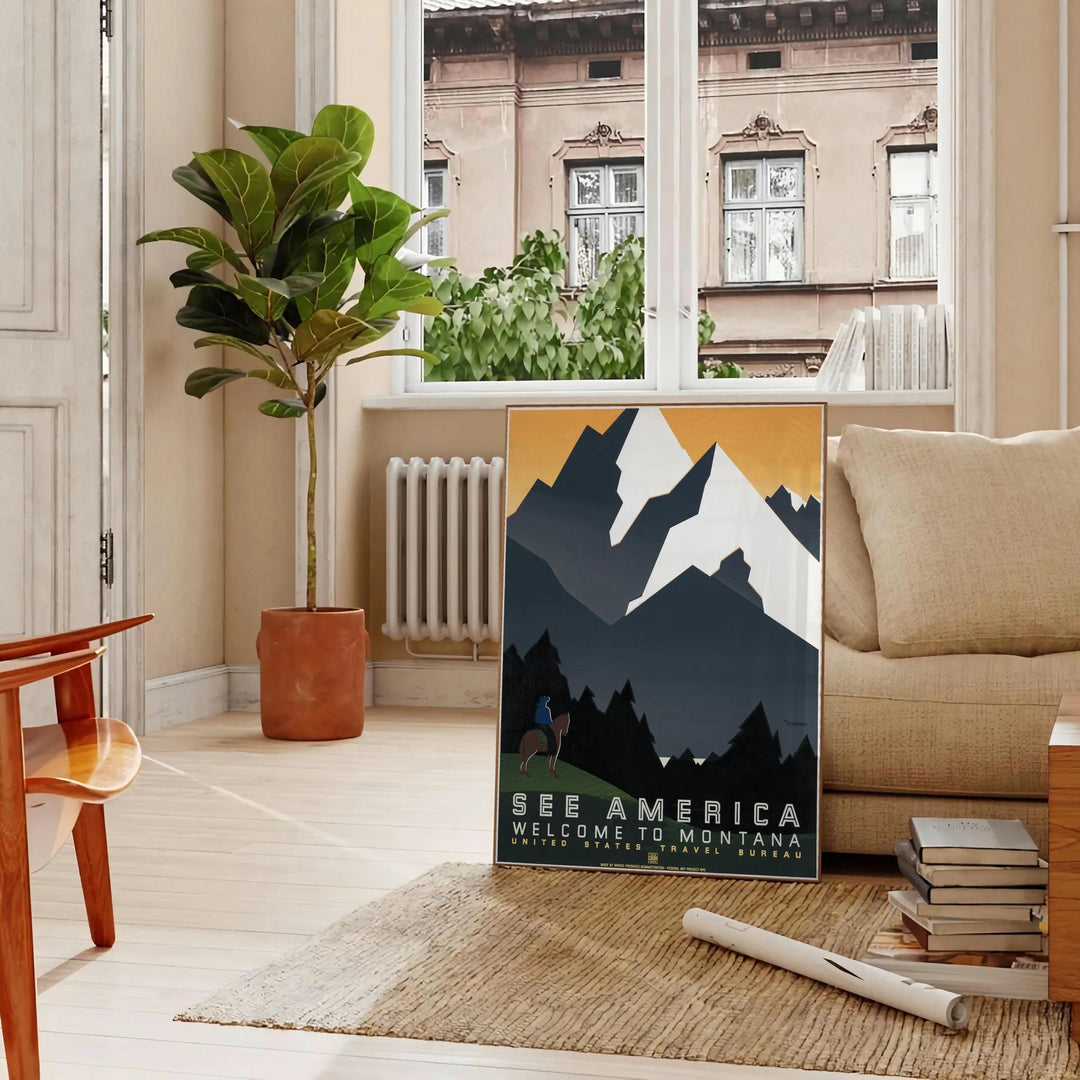 Vintage travel poster depicting Montana's green valleys under an orange sky - in a Parisian living room with a sofa and a fig plant
