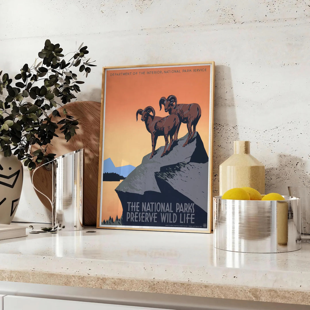 Stylized travel poster featuring an American national park with black and orange colors - styled on a counter with eucalyptus and a bowl of lemons