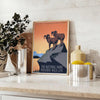 Stylized travel poster featuring an American national park with black and orange colors - styled on a counter with eucalyptus and a bowl of lemons