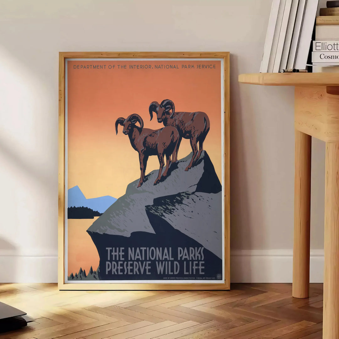 Stylized travel poster featuring an American national park with black and orange colors - beside a round wooden side table with books