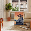 Stylized travel poster featuring an American national park with black and orange colors - in a Parisian living room with a sofa and a fig plant