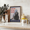 Poster of stylized railroad travel artwork in green and blue tones - styled on a counter with eucalyptus and a bowl of lemons