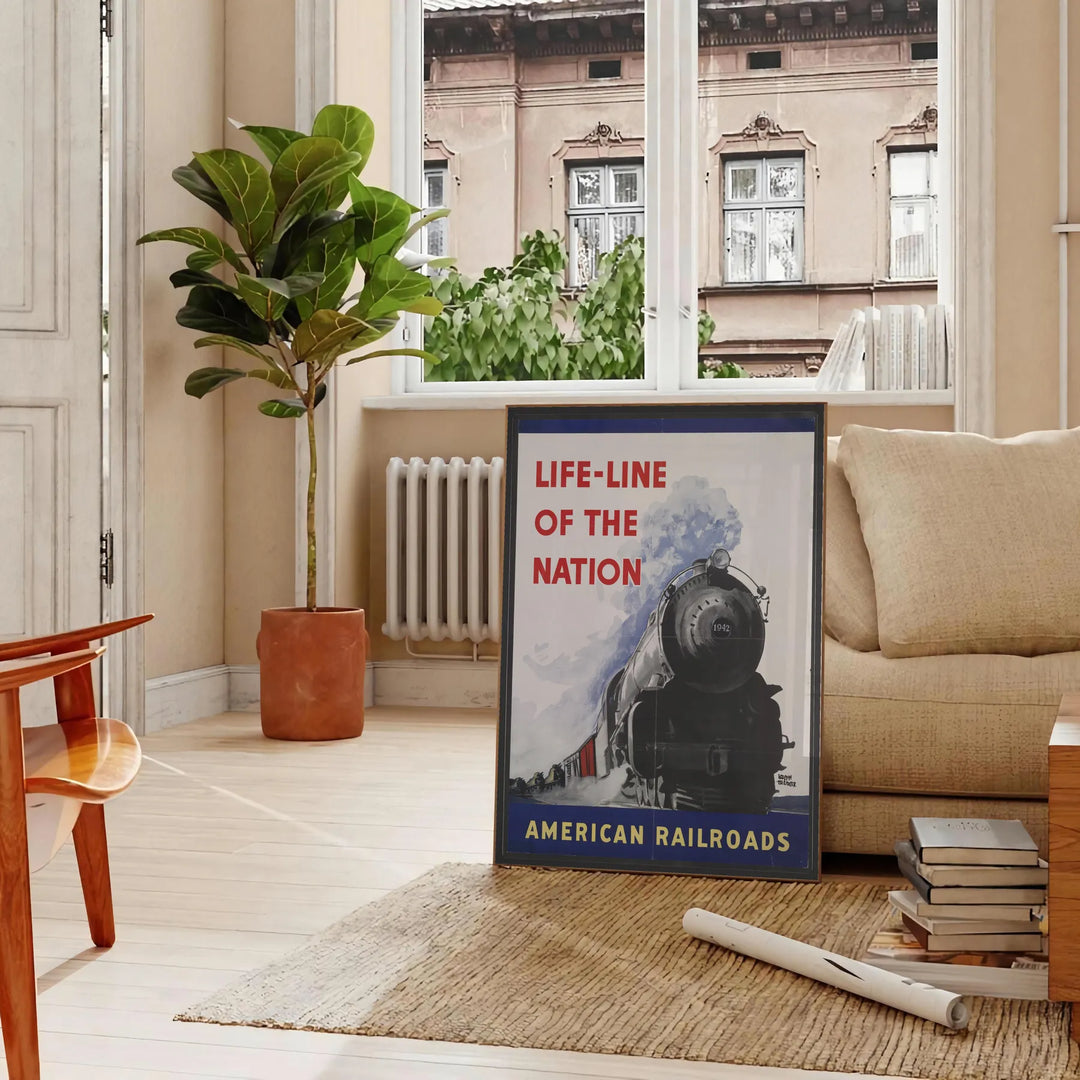 Poster of stylized railroad travel artwork in green and blue tones - in a Parisian living room with a sofa and a fig plant