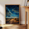 Antique oil painting depicting a lush green landscape with serene blue skies - beside a round wooden side table with books