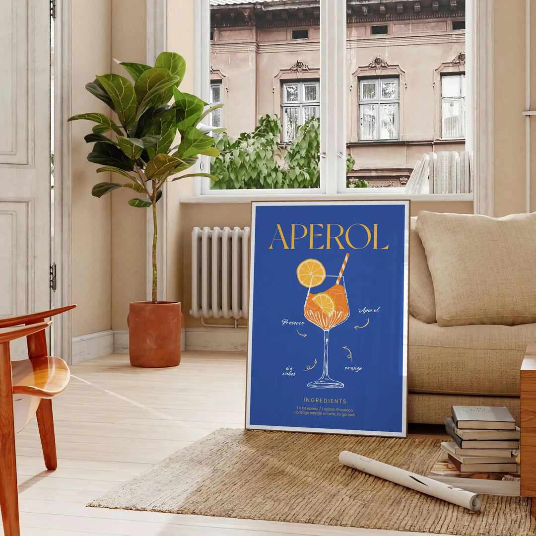 Aperol cocktail poster in bold blue and yellow modern abstract illustration - in a Parisian living room with a sofa and a fig plant
