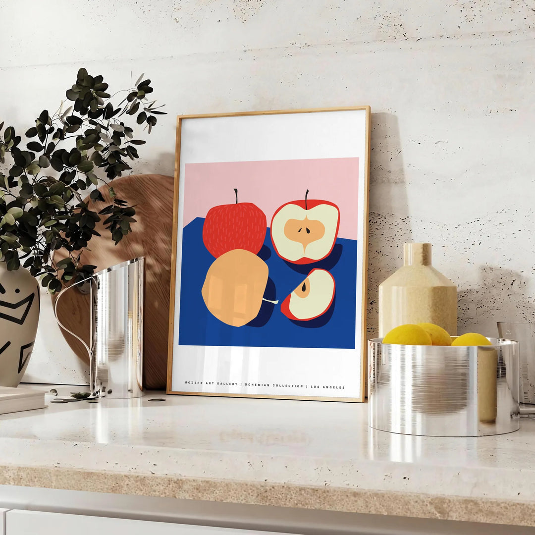 Artwork featuring a realistic apple against a textured blue background - styled on a counter with eucalyptus and a bowl of lemons