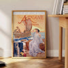 Vintage poster featuring a gray silhouette of the Ariane rocket against a brown background - beside a round wooden side table with books
