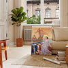 Vintage poster featuring a gray silhouette of the Ariane rocket against a brown background - in a Parisian living room with a sofa and a fig plant