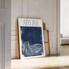 Atelier Maximalist blue and green abstract maximalist poster with layered shapes - leaning on a herringbone floor against a white panelled wall