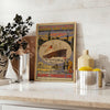 Black and gray Atlantic transport liner travel poster, vintage graphic artwork - styled on a counter with eucalyptus and a bowl of lemons