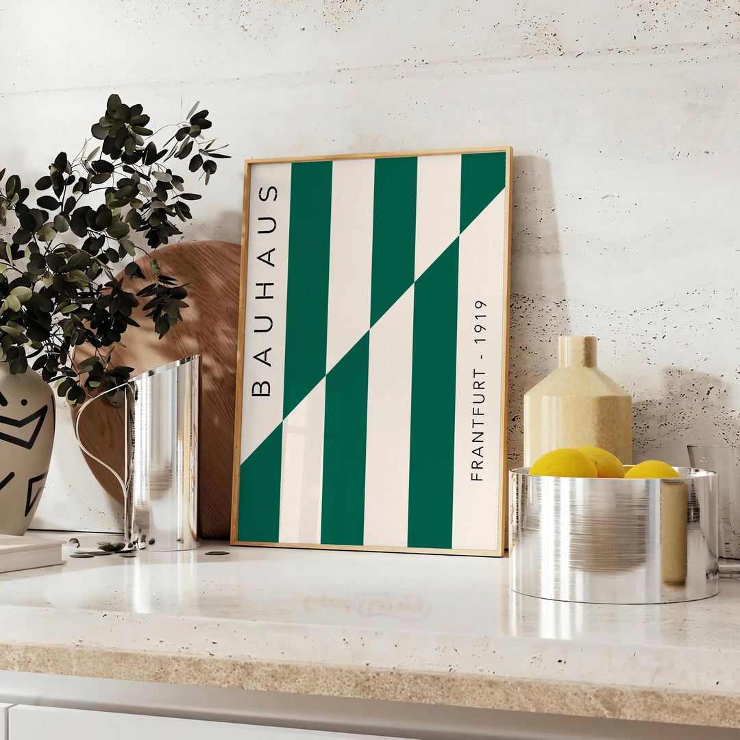 Gray and green abstract design with geometric shapes in Bauhaus style - styled on a counter with eucalyptus and a bowl of lemons