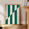 Gray and green abstract design with geometric shapes in Bauhaus style - beside a round wooden side table with books