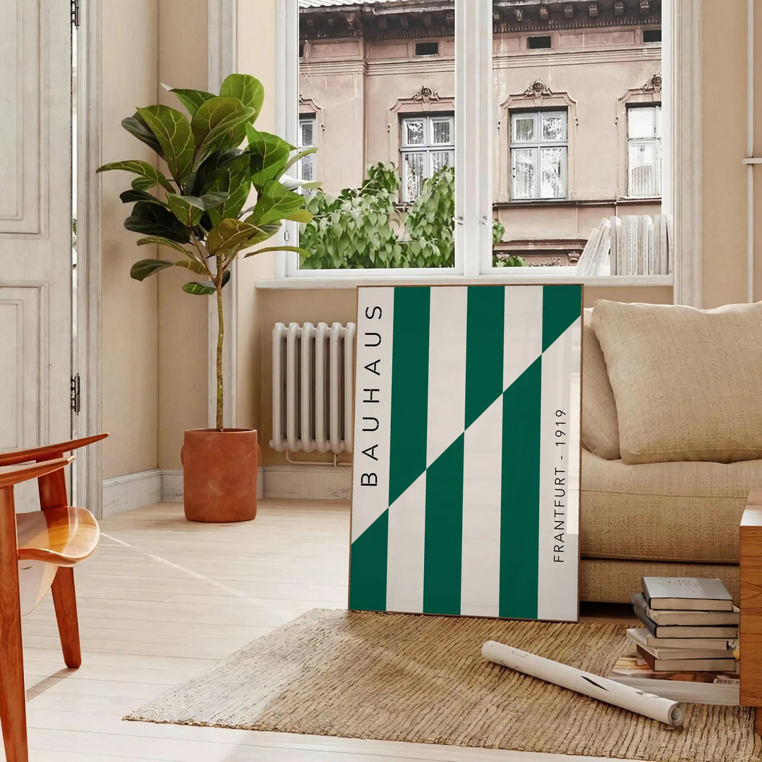 Gray and green abstract design with geometric shapes in Bauhaus style - in a Parisian living room with a sofa and a fig plant
