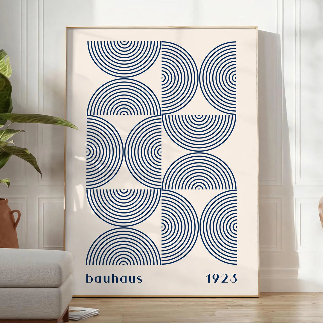 Bauhaus abstract poster with gray and blue geometric shapes, modern print - in a bright minimalist room with a plant and an armchair