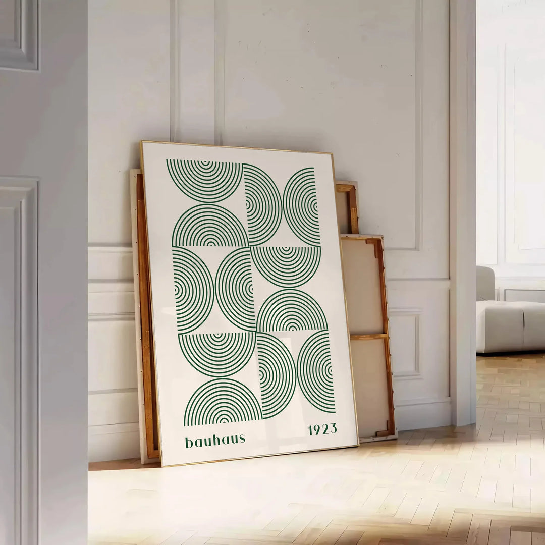 Poster showing Bauhaus abstract geometric composition in minimalist modern style - leaning on a herringbone floor against a white panelled wall