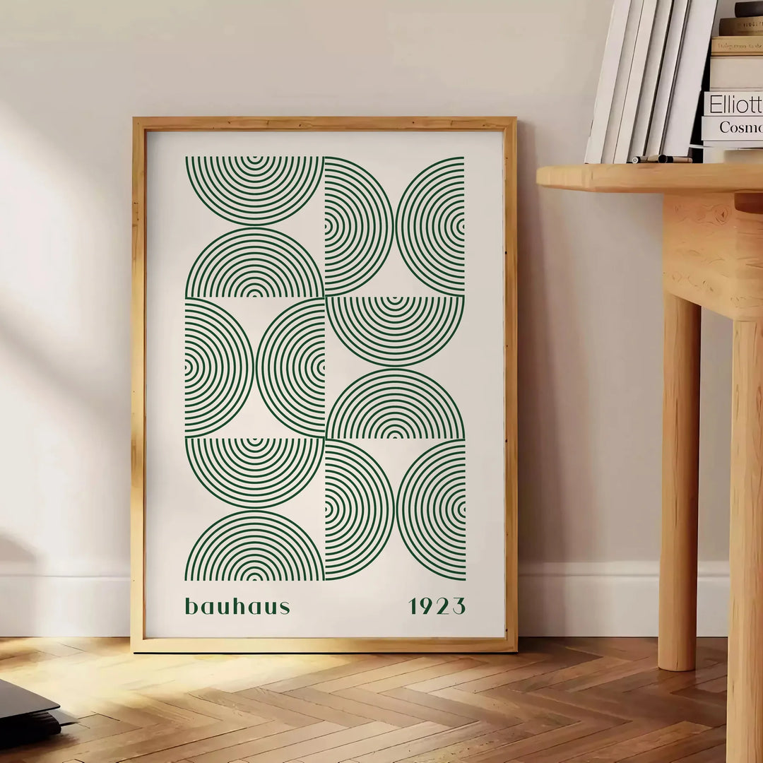Poster showing Bauhaus abstract geometric composition in minimalist modern style - beside a round wooden side table with books