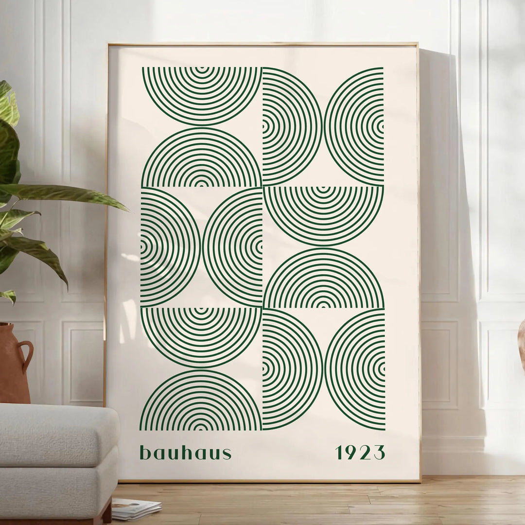 Poster showing Bauhaus abstract geometric composition in minimalist modern style - in a bright minimalist room with a plant and an armchair