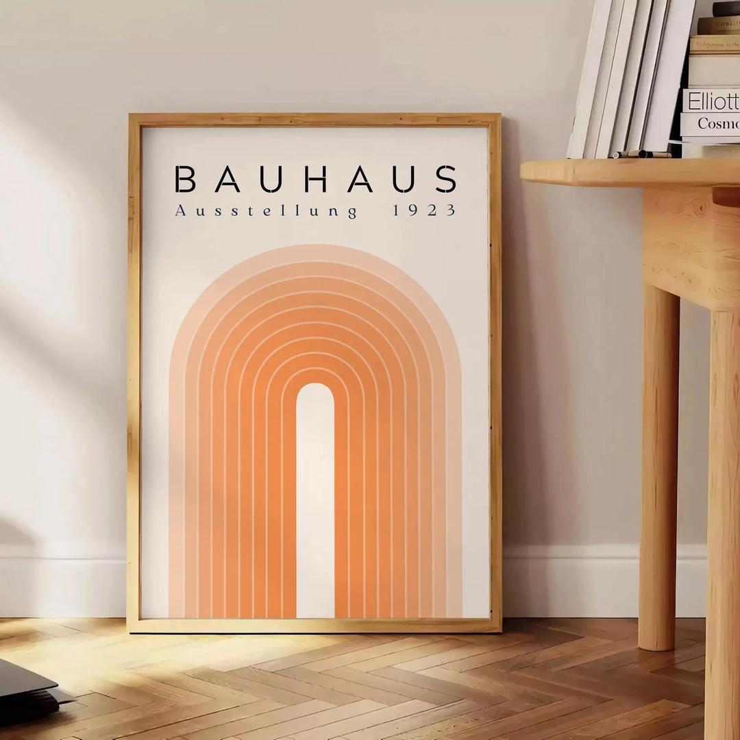 Poster of Bauhaus abstract geometric modernist design in red blue black - beside a round wooden side table with books