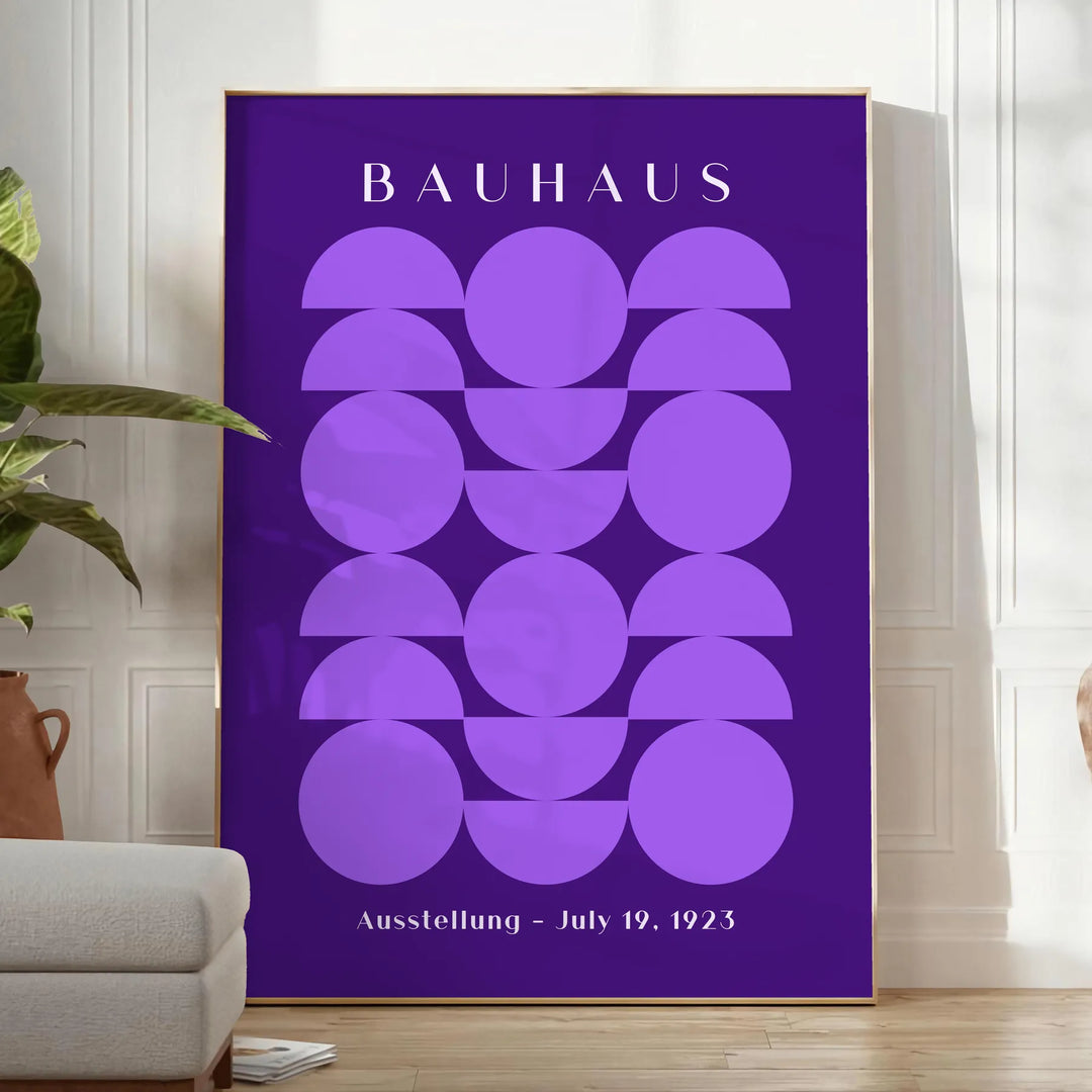 Purple and white geometric Bauhaus poster, bold minimalist shapes on paper - in a bright minimalist room with a plant and an armchair