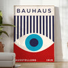 Bauhaus geometric poster with blue and red abstract shapes - in a bright minimalist room with a plant and an armchair
