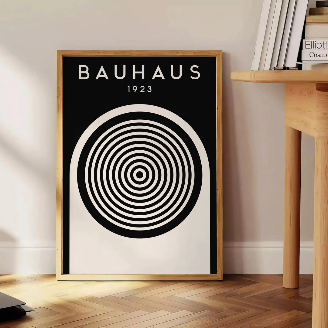 Abstract geometric shapes in Bauhaus style with primary colors - beside a round wooden side table with books