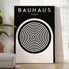 Abstract geometric shapes in Bauhaus style with primary colors - in a bright minimalist room with a plant and an armchair