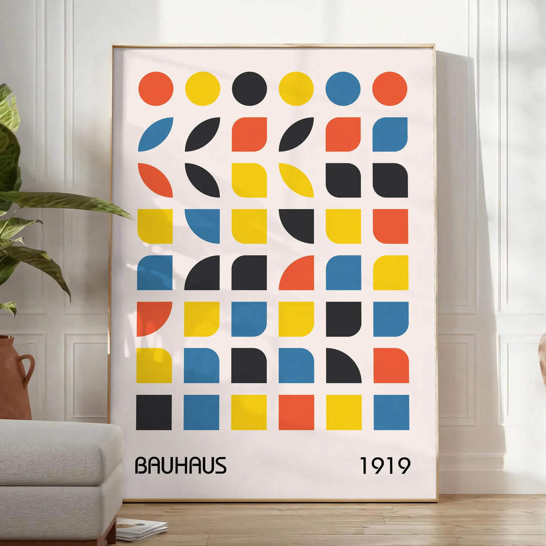 Bauhaus style abstract design with dynamic shapes in orange and blue - in a bright minimalist room with a plant and an armchair