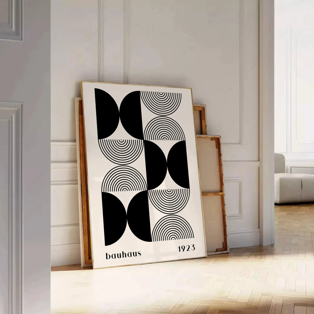 Abstract geometric shapes in Bauhaus style with bold colors - leaning on a herringbone floor against a white panelled wall