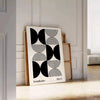 Abstract geometric shapes in Bauhaus style with bold colors - leaning on a herringbone floor against a white panelled wall