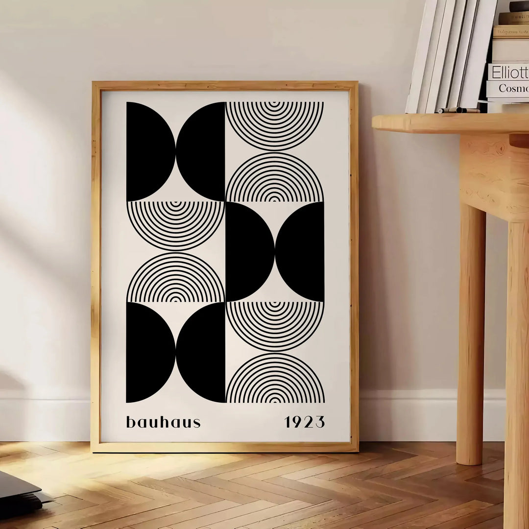 Abstract geometric shapes in Bauhaus style with bold colors - beside a round wooden side table with books