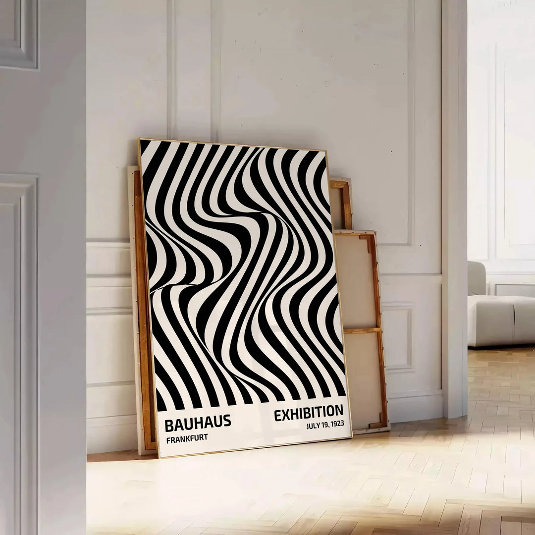 Abstract geometric shapes in Bauhaus style with bold primary colors - leaning on a herringbone floor against a white panelled wall