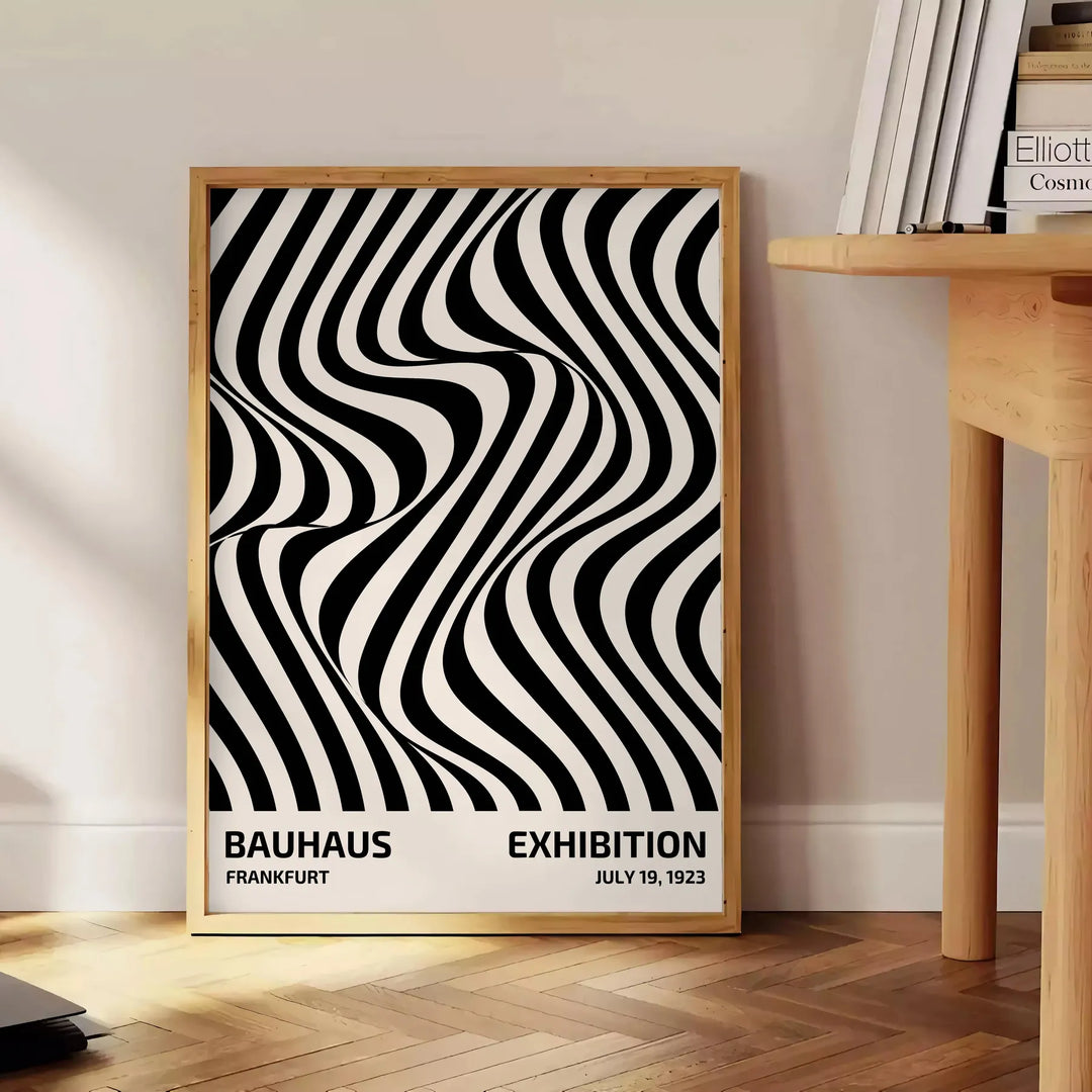 Abstract geometric shapes in Bauhaus style with bold primary colors - beside a round wooden side table with books