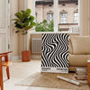 Abstract geometric shapes in Bauhaus style with bold primary colors - in a Parisian living room with a sofa and a fig plant