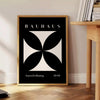 Abstract Bauhaus design with geometric shapes in gray and black tones - beside a round wooden side table with books