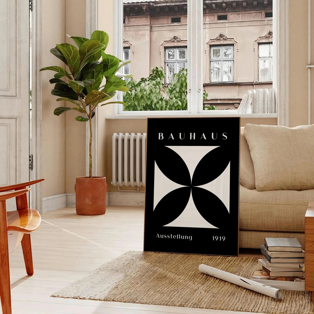 Abstract Bauhaus design with geometric shapes in gray and black tones - in a Parisian living room with a sofa and a fig plant