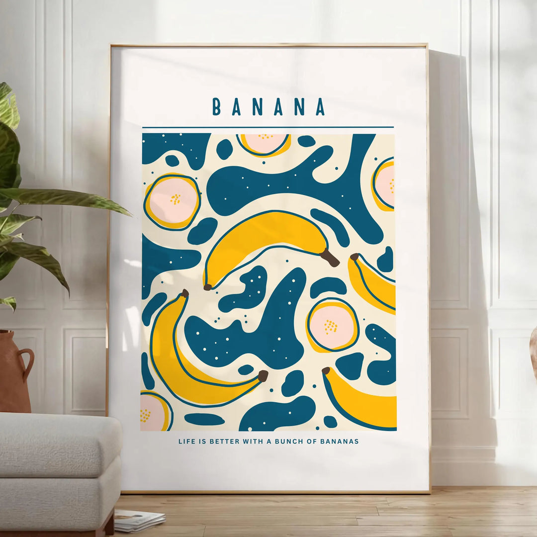 Gray and orange minimalist banana kitchen art poster, modern playful design - in a bright minimalist room with a plant and an armchair