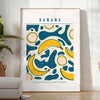 Gray and orange minimalist banana kitchen art poster, modern playful design - in a bright minimalist room with a plant and an armchair