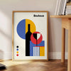 Bauhaus abstract geometric poster with bold primary colors, modern minimal composition - beside a round wooden side table with books