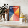 Bauhaus geometric artwork poster with bold primary colors and shapes - styled on a counter with eucalyptus and a bowl of lemons