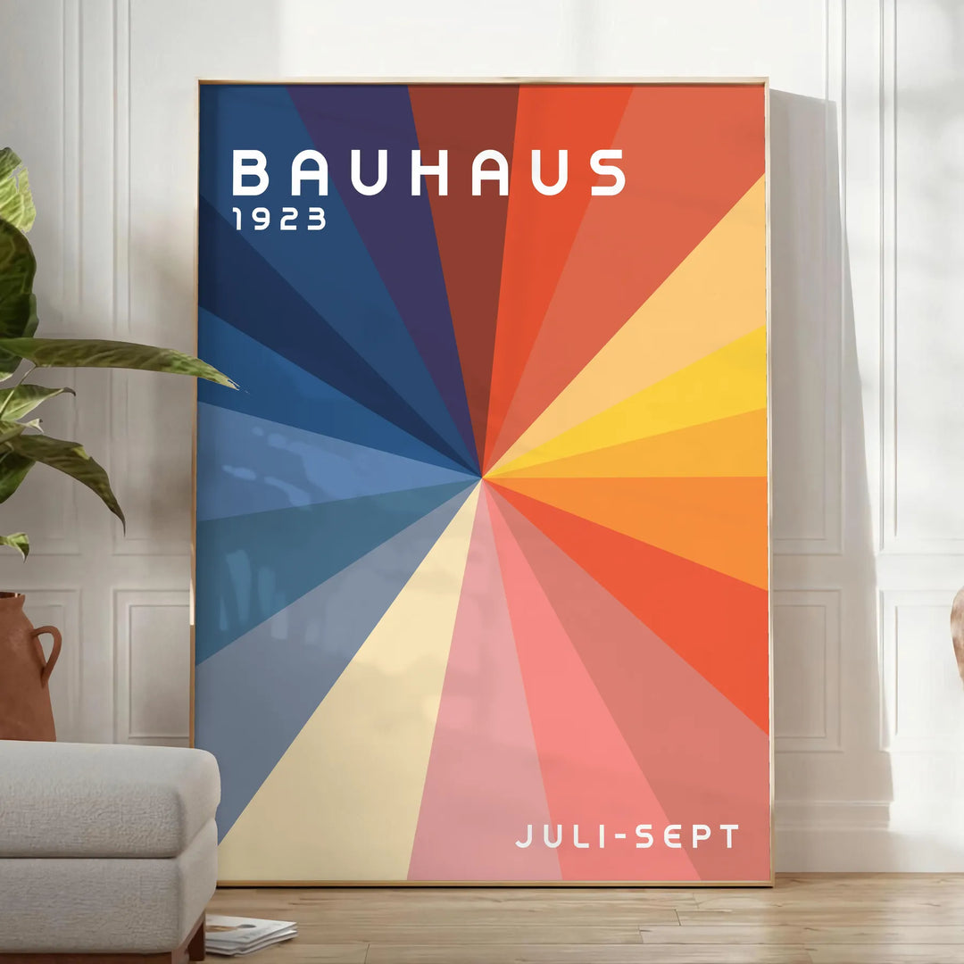 Bauhaus geometric artwork poster with bold primary colors and shapes - in a bright minimalist room with a plant and an armchair