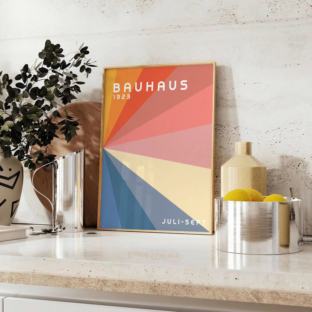 Gray and red geometric Bauhaus poster featuring vintage abstract modernist composition - styled on a counter with eucalyptus and a bowl of lemons