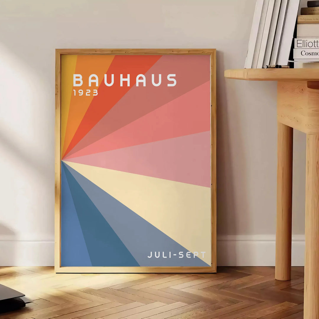Gray and red geometric Bauhaus poster featuring vintage abstract modernist composition - beside a round wooden side table with books