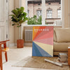 Gray and red geometric Bauhaus poster featuring vintage abstract modernist composition - in a Parisian living room with a sofa and a fig plant