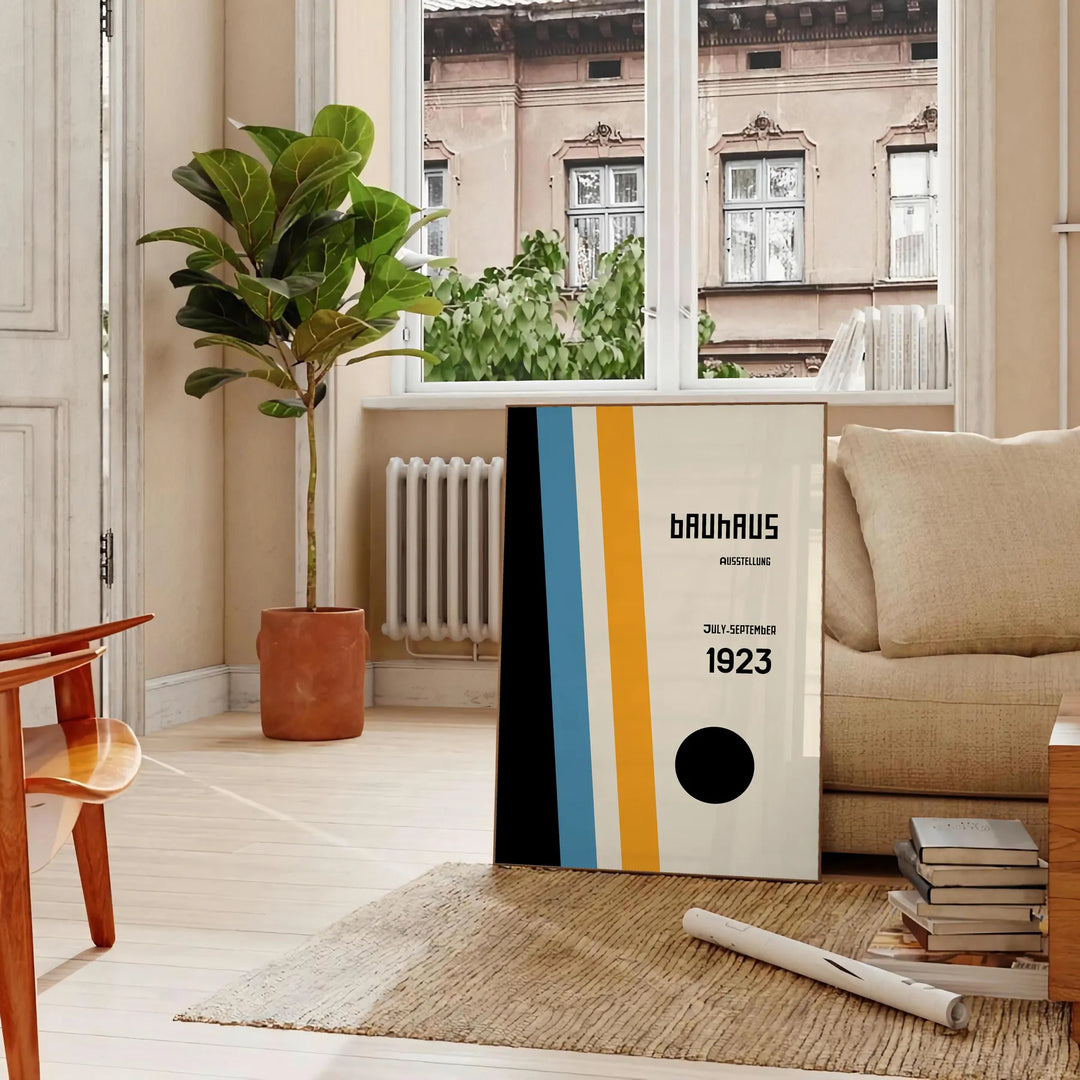 Gray and white Bauhaus geometric abstract art poster, minimalist design - in a Parisian living room with a sofa and a fig plant