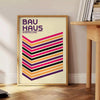 Geometric shapes in primary colors inspired by Bauhaus design - beside a round wooden side table with books