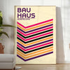 Geometric shapes in primary colors inspired by Bauhaus design - in a bright minimalist room with a plant and an armchair