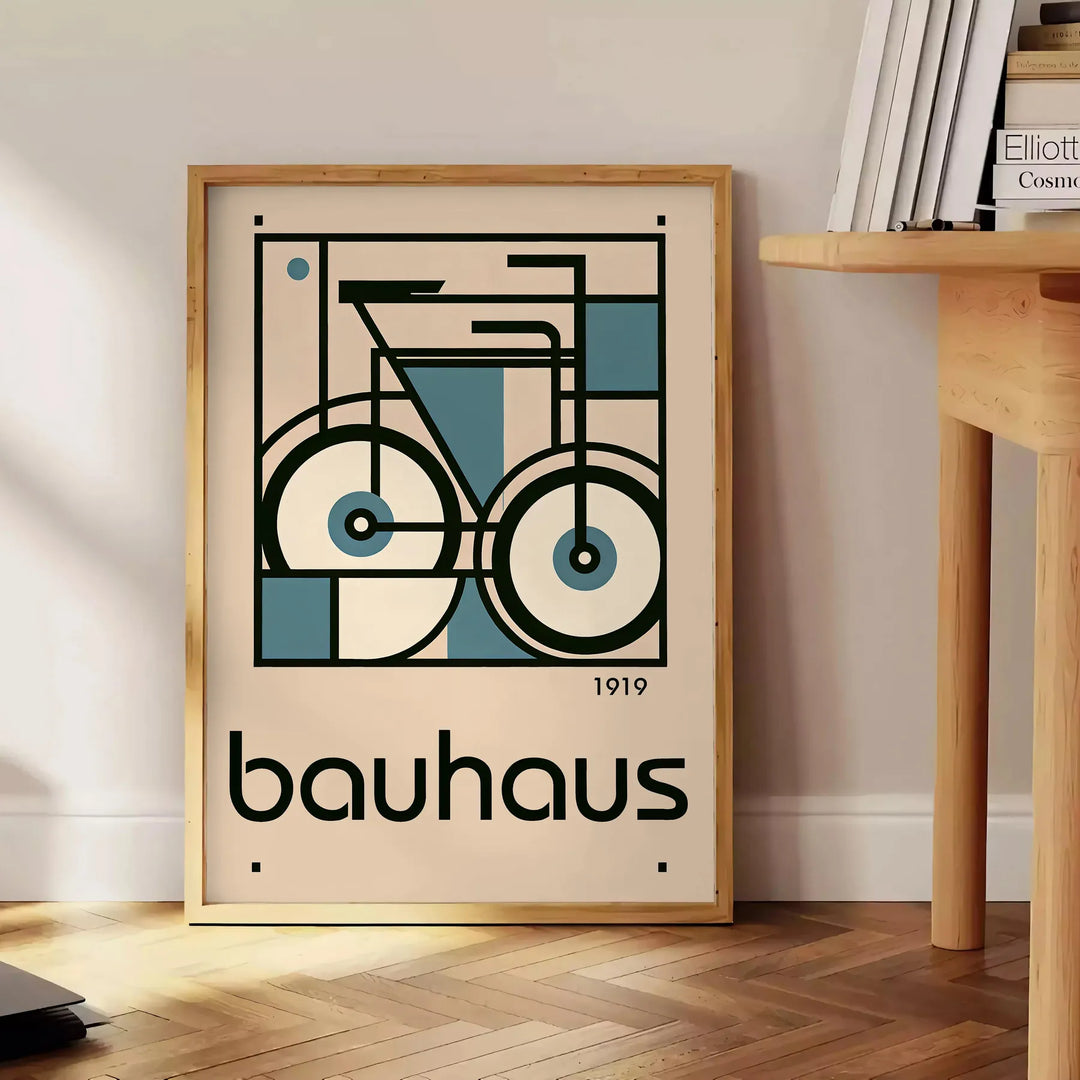 Minimalist poster of a bicycle in Bauhaus style with geometric shapes - beside a round wooden side table with books