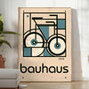 Minimalist poster of a bicycle in Bauhaus style with geometric shapes - in a bright minimalist room with a plant and an armchair