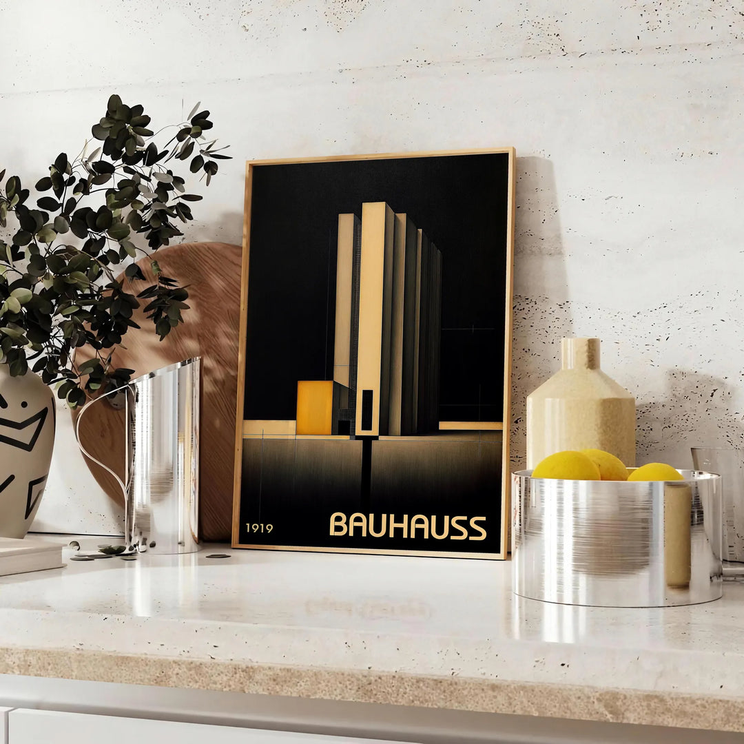Dark Bauhaus geometric art poster in black and gray minimalist style - styled on a counter with eucalyptus and a bowl of lemons